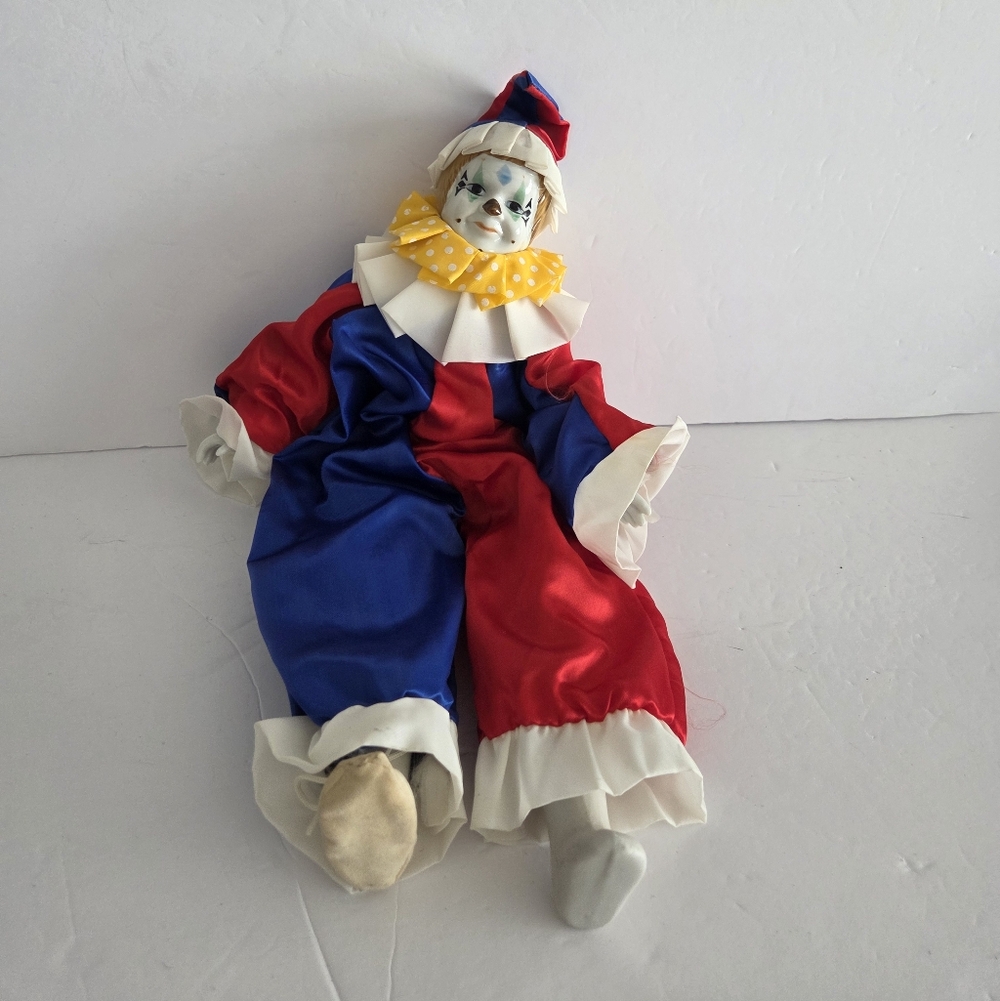 Noble Arts Inc. Red and Blue Clown Porcelain Doll with Yellow Polka Dot Collar